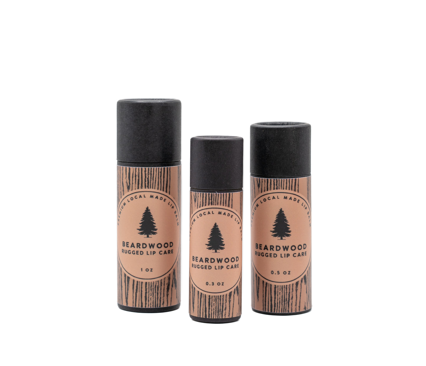 Three tubs of Beardwood Beard Oil lip balm are shown in wood-styled tubes and named Rugged Lip Care. The Beardwood Beard Oil logo in on the front.
