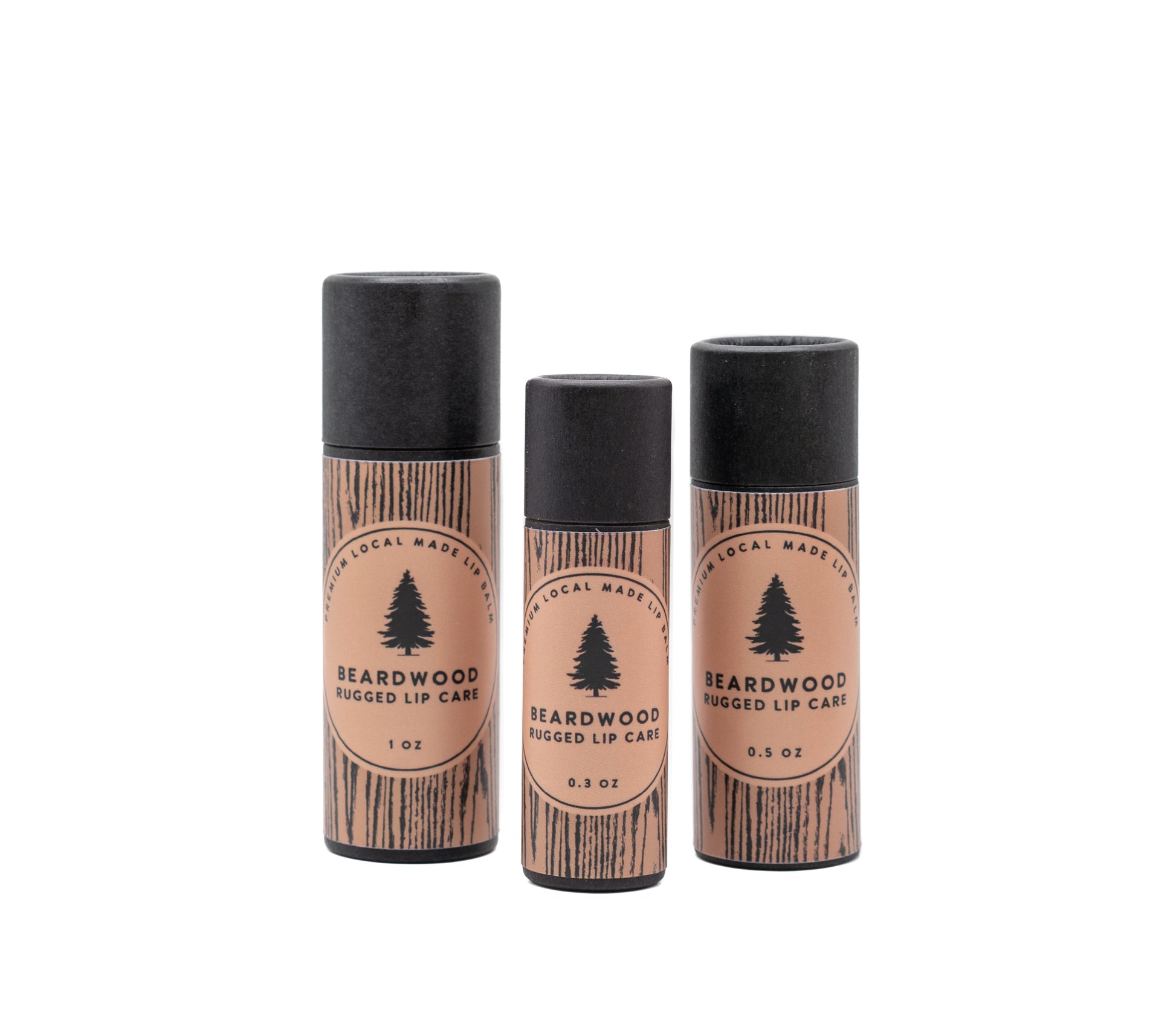 Three tubs of Beardwood Beard Oil lip balm are shown in wood-styled tubes and named Rugged Lip Care. The Beardwood Beard Oil logo in on the front.